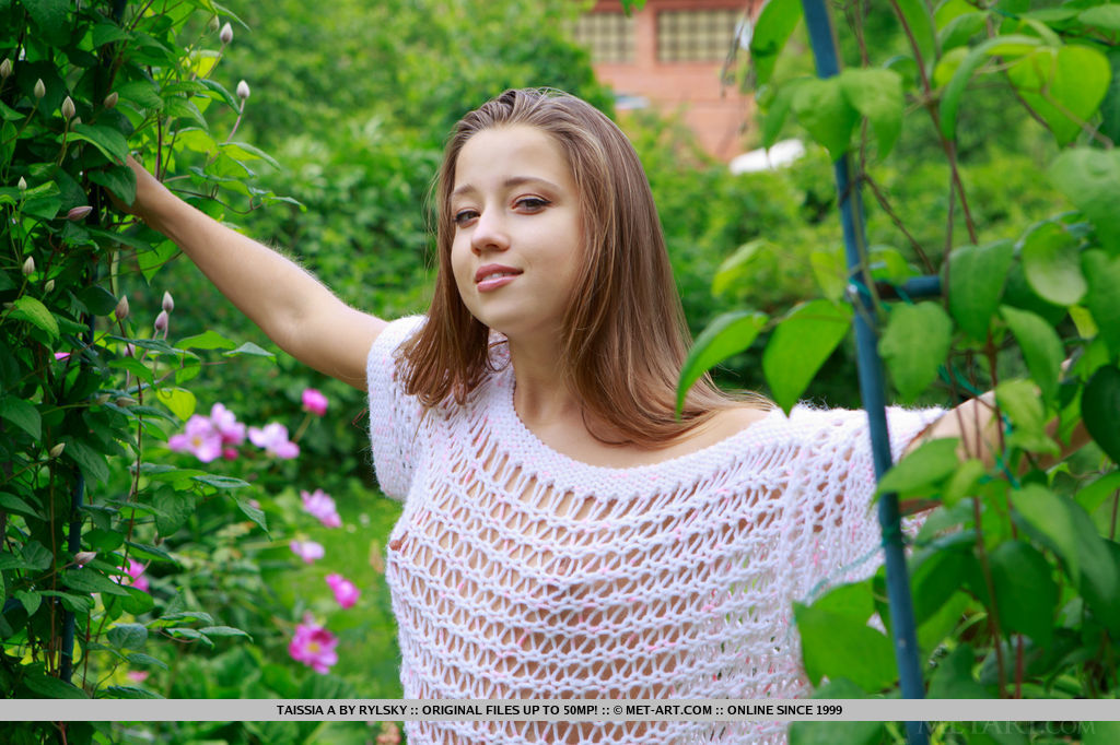 Pretty faced teen Taissia A flashing tiny boobs outdoors in the garden #55683834