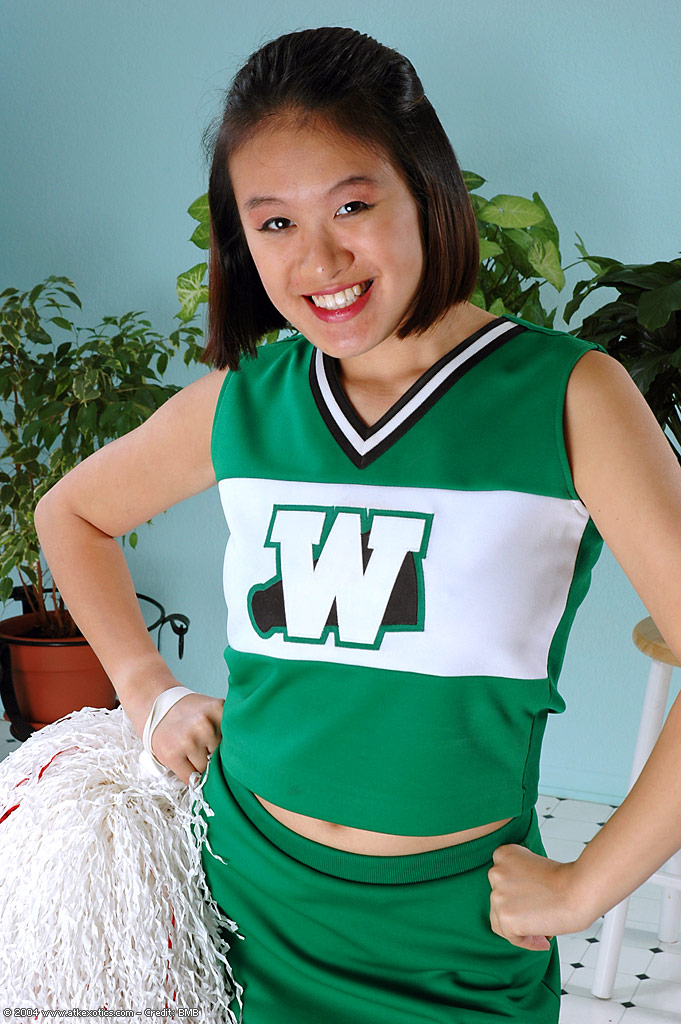 Amateur Asian freeing big tits and ass from beneath cheerleader uniform #50313809