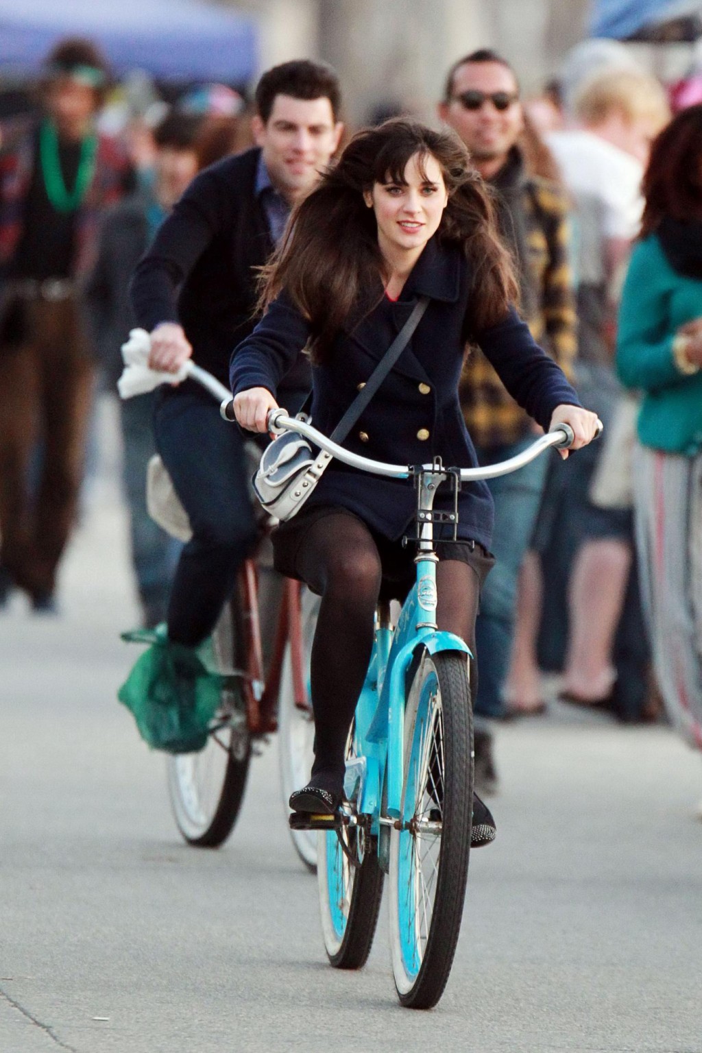 Zooey Deschanel upskirt while cycling in mini skirt  pantyhose on the 'New Girl' #75278290