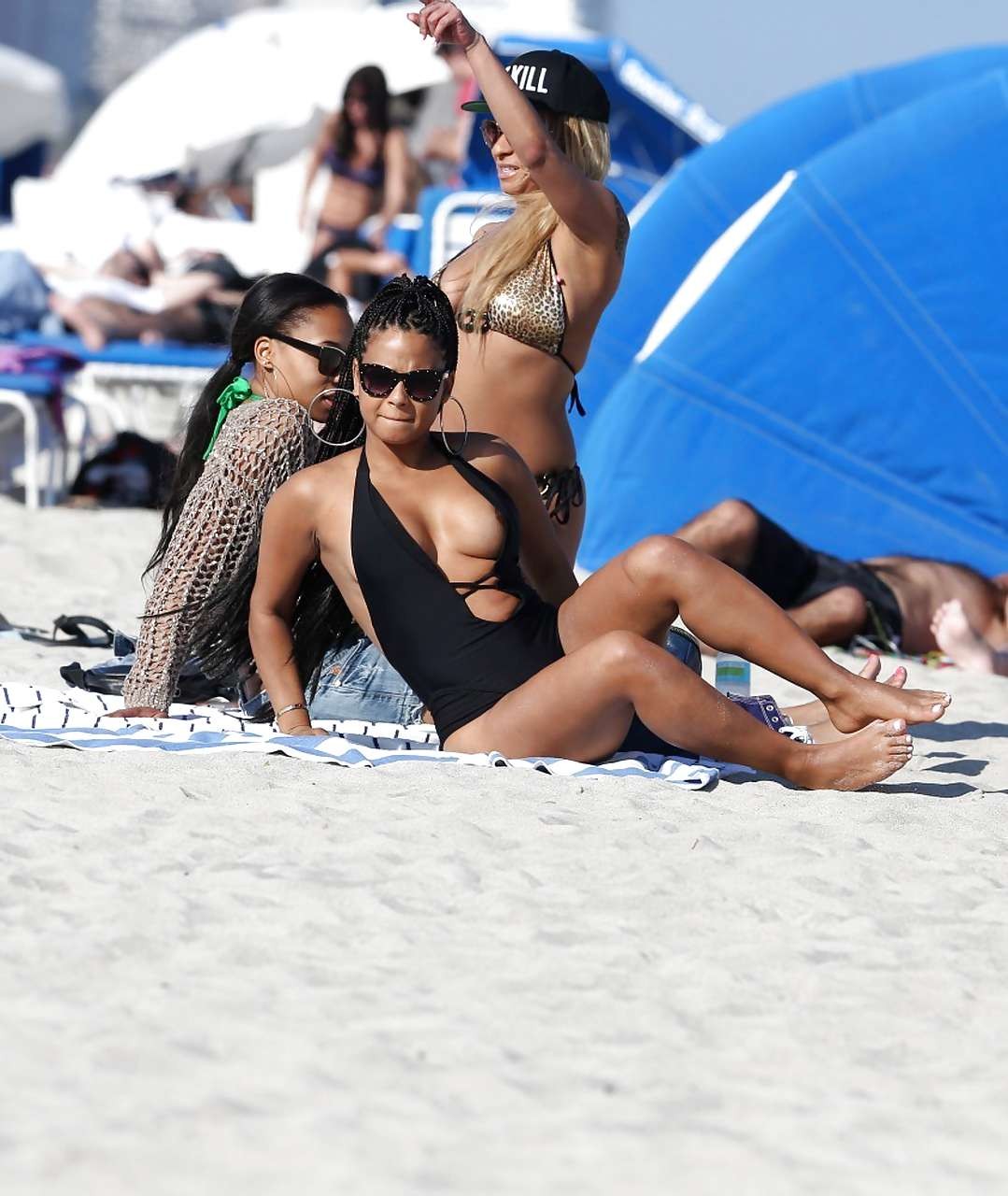 Christina Milian exposing nipples slip in bikini on beach