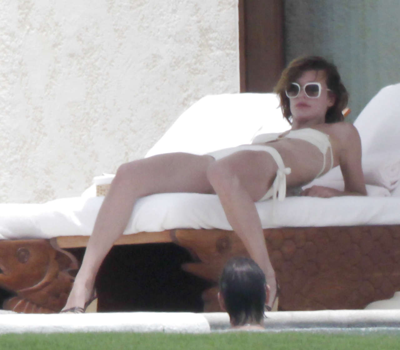 Milla Jovovich showing her ass in thong upskirt and topless in pool #75263256