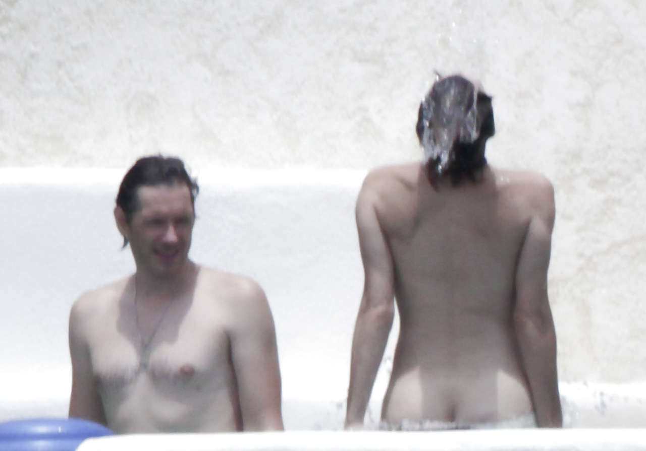 Milla Jovovich showing her ass in thong upskirt and topless in pool #75263268