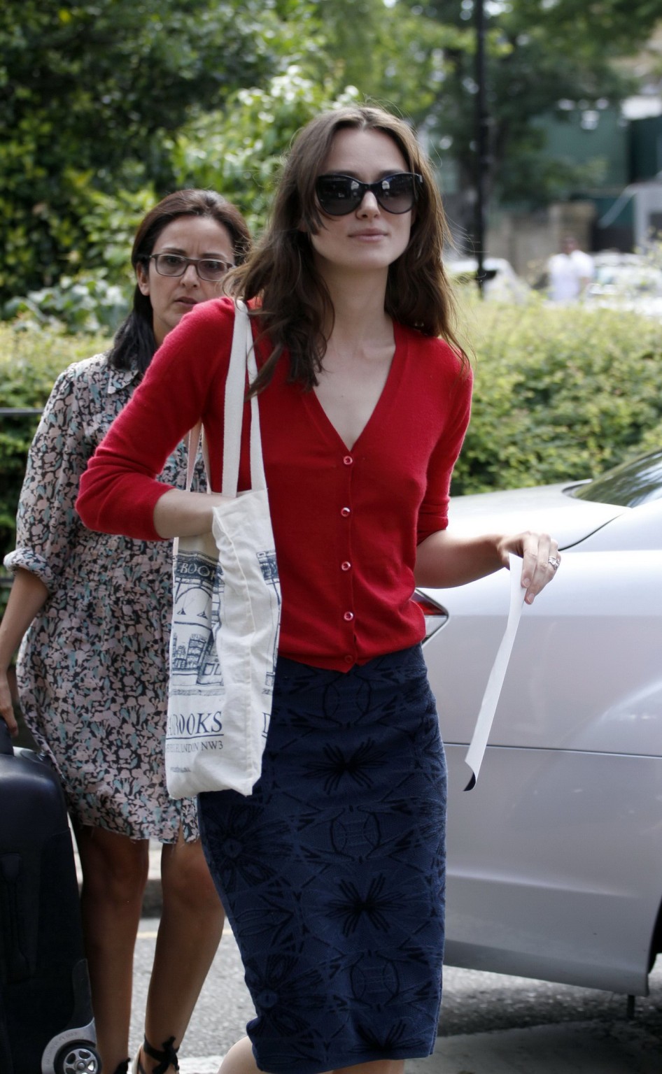 Keira Knightley showing hard pokies braless in red top and skirt out in London #75194178