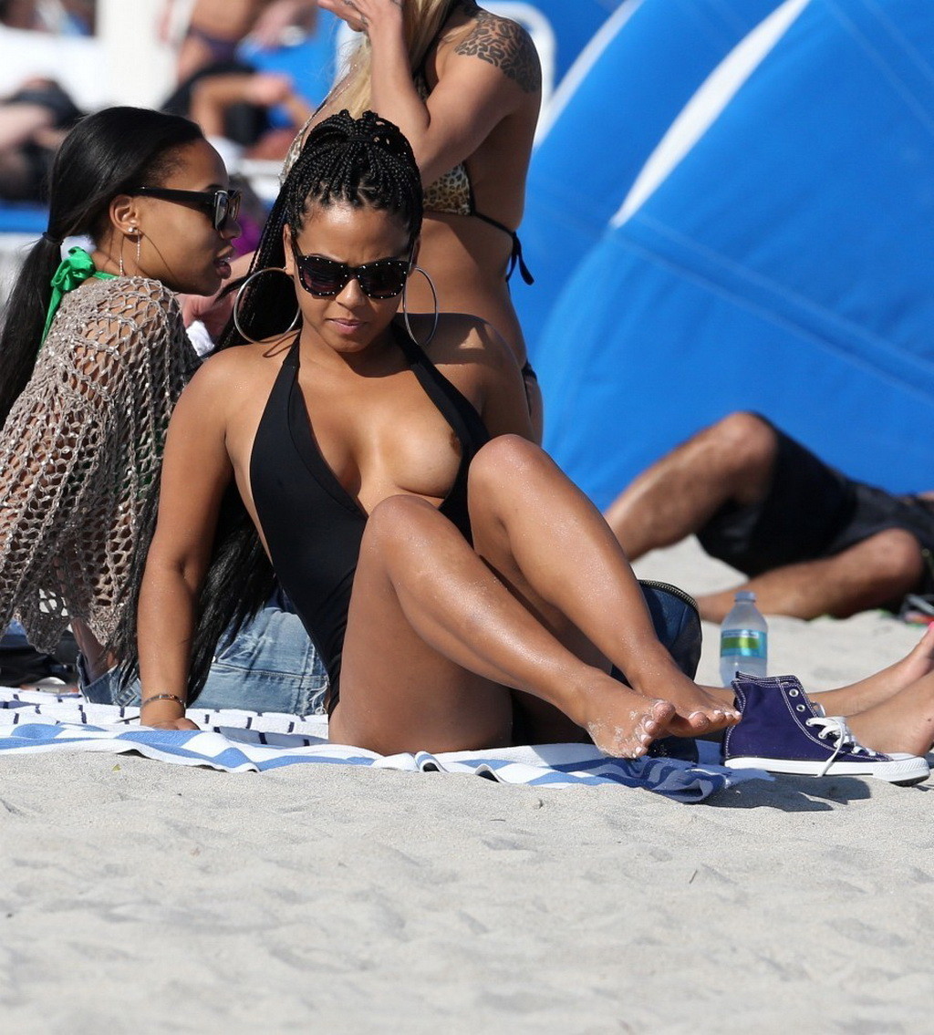 Christina Milian nipple slip wearing a skimpy black swimsuit in Miami Beach #75242709