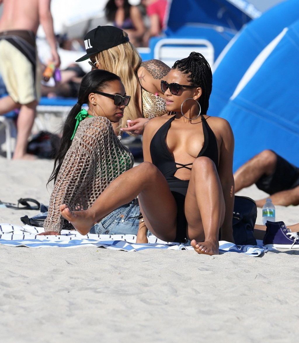 Christina Milian nipple slip wearing a skimpy black swimsuit in Miami Beach #75242714
