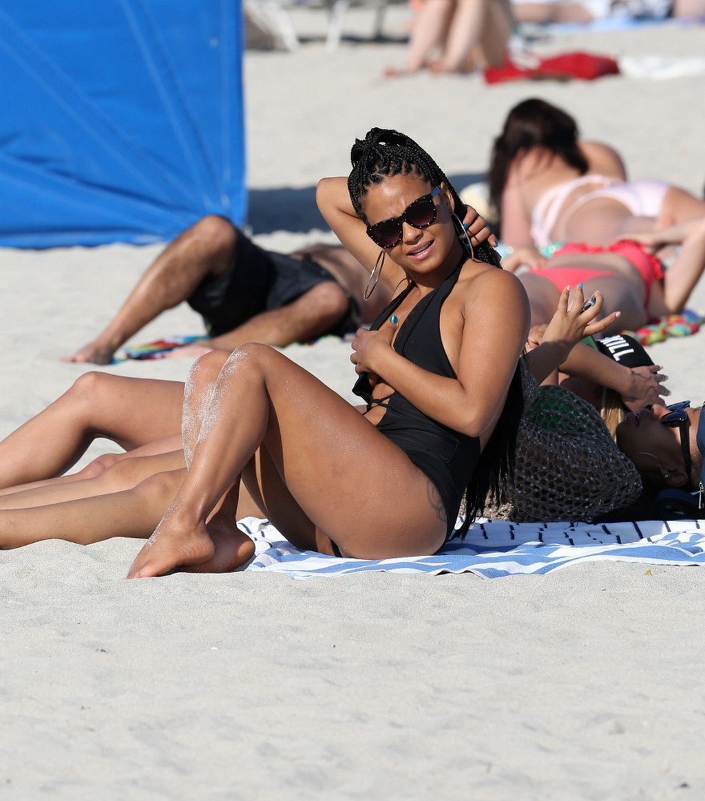 Christina Milian nipple slip wearing a skimpy black swimsuit in Miami Beach #75242739