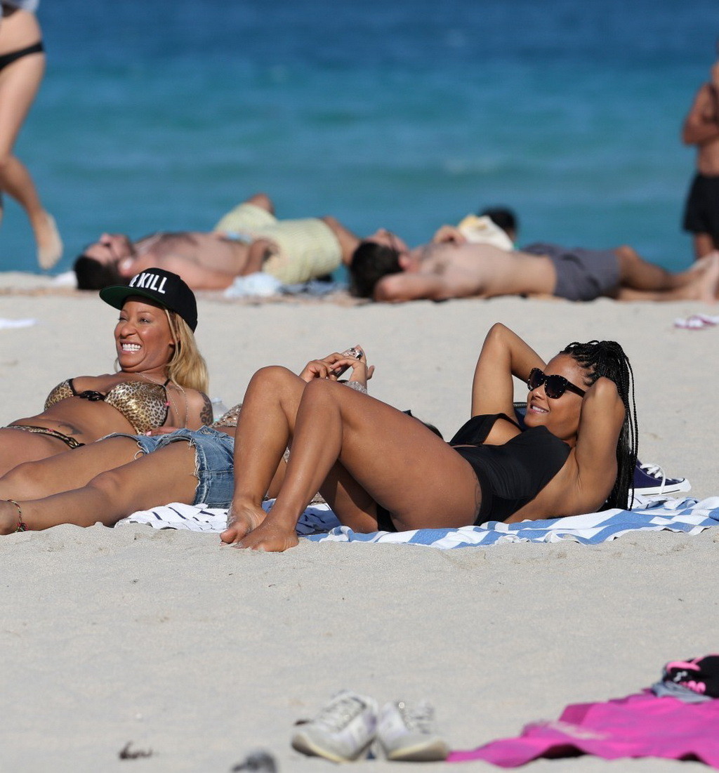 Christina Milian nipple slip wearing a skimpy black swimsuit in Miami Beach #75242748