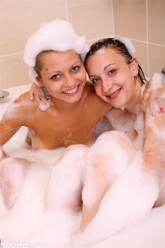 Naughty sexy young chicks taking a hot bubble bath together #67879379