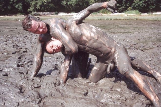 Two muscle dudes outdoor wrestling and pounding in the dirt #76959945