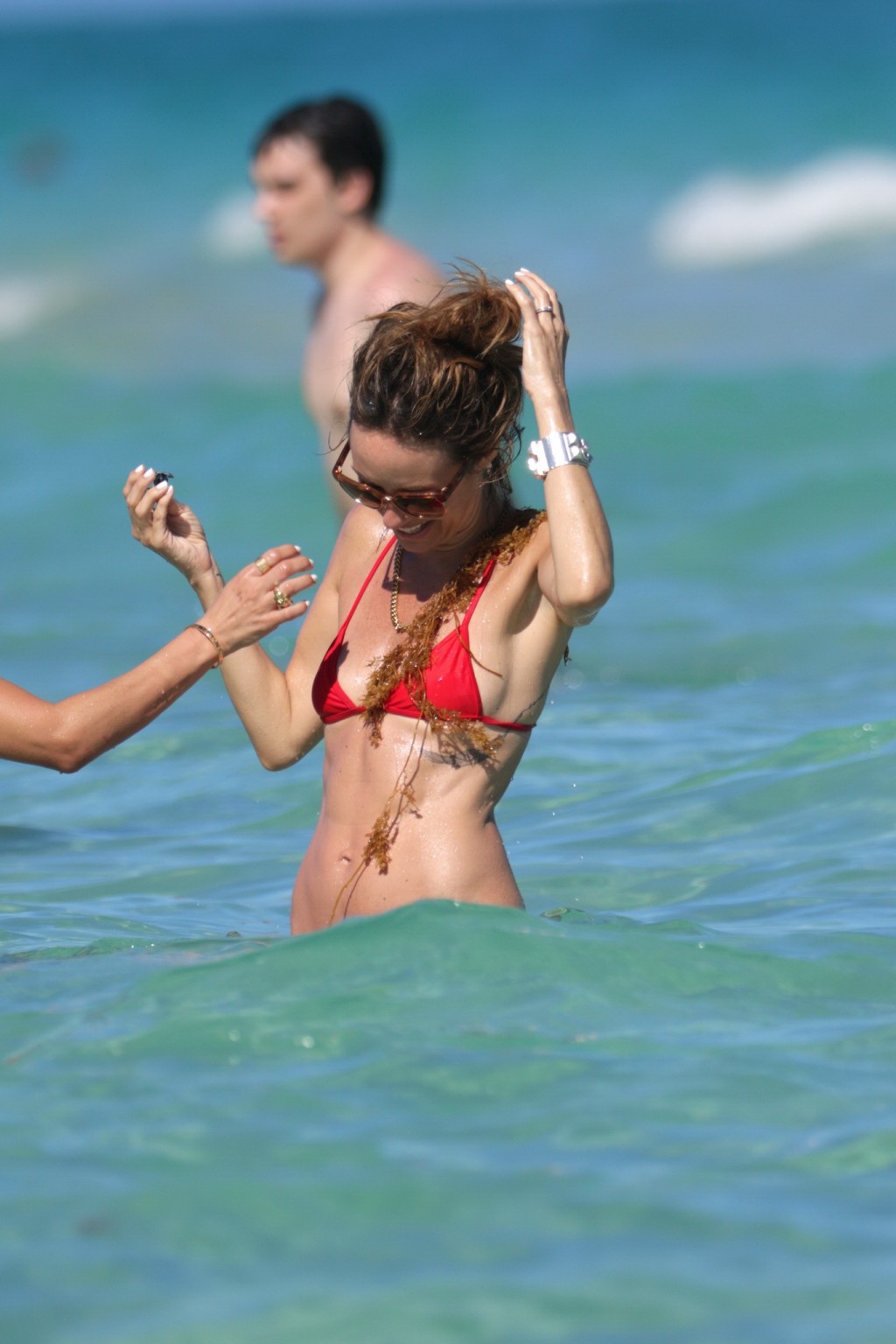 Catt Sadler showing sideboob and shaved crotch in tiny red bikini at the beach i #75167950