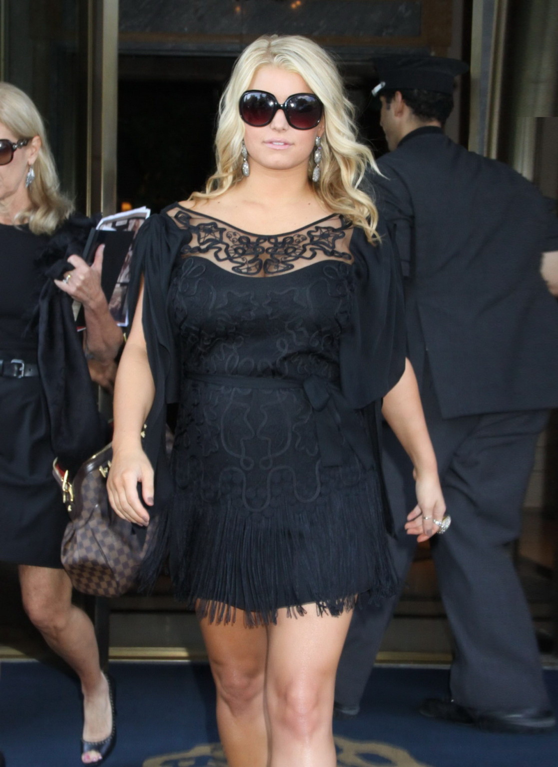 Jessica Simpson looks very sexy in black mini dress leaving The Ritz-Carlton Hot