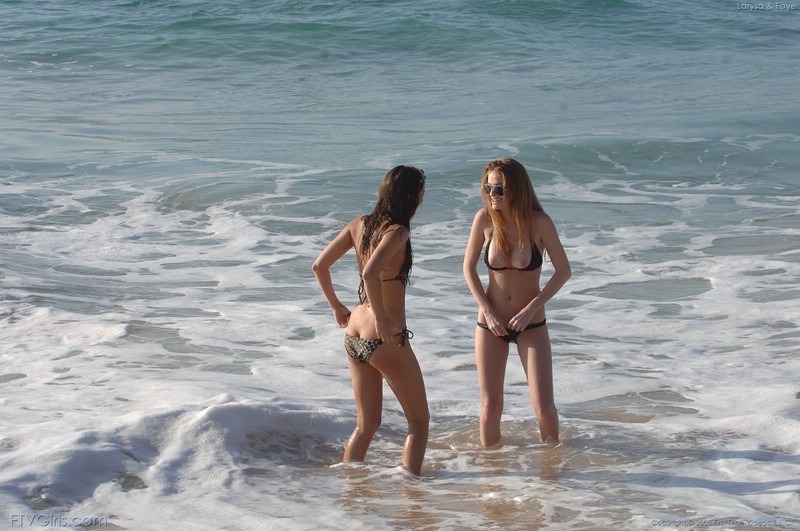 Two Bikini Babes Playing On the Beach #72316774