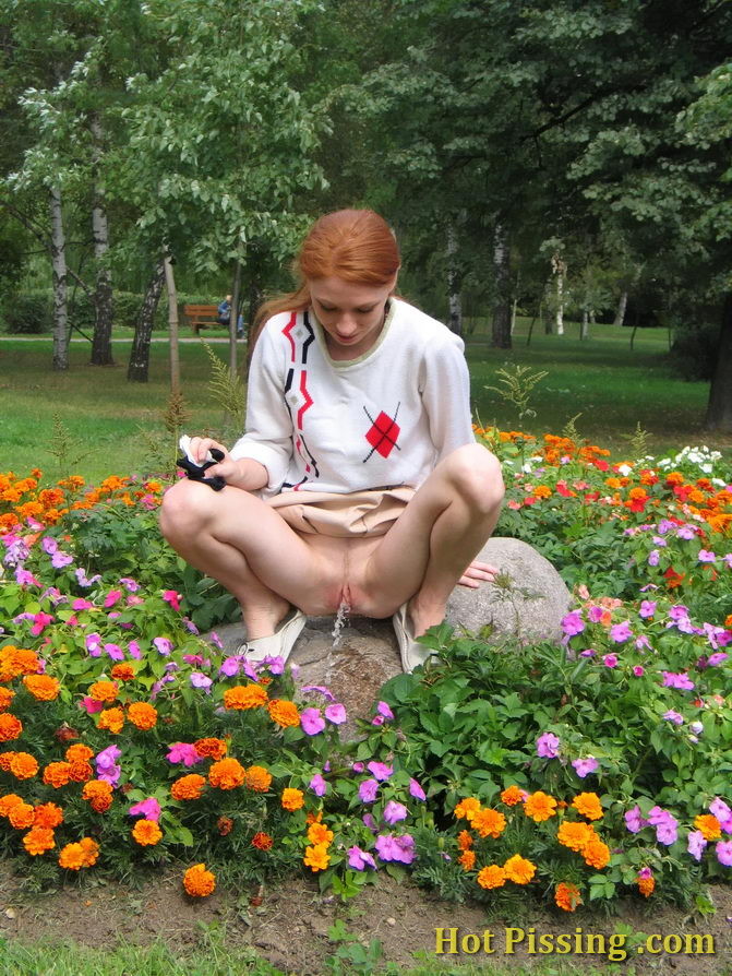 Naughty wench squats in the middle of a flowerbed and makes a pee-pee #76573045