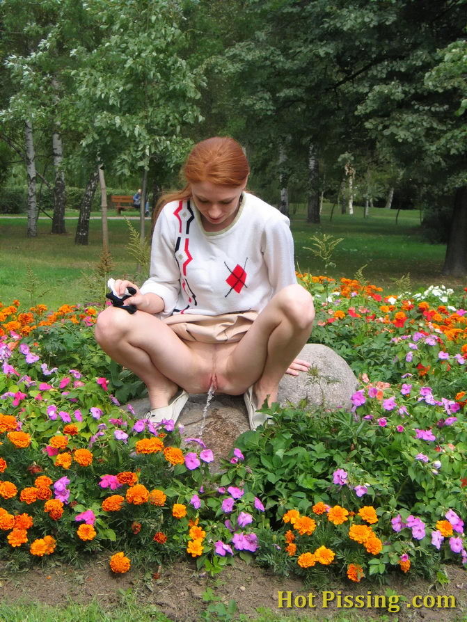 Naughty wench squats in the middle of a flowerbed and makes a pee-pee #76573051