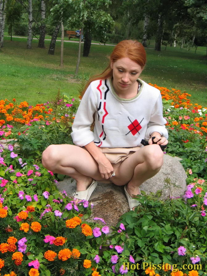 Naughty wench squats in the middle of a flowerbed and makes a pee-pee #76573076