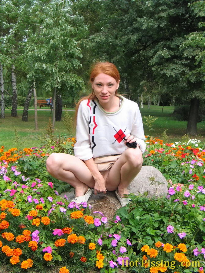 Naughty wench squats in the middle of a flowerbed and makes a pee-pee #76573083