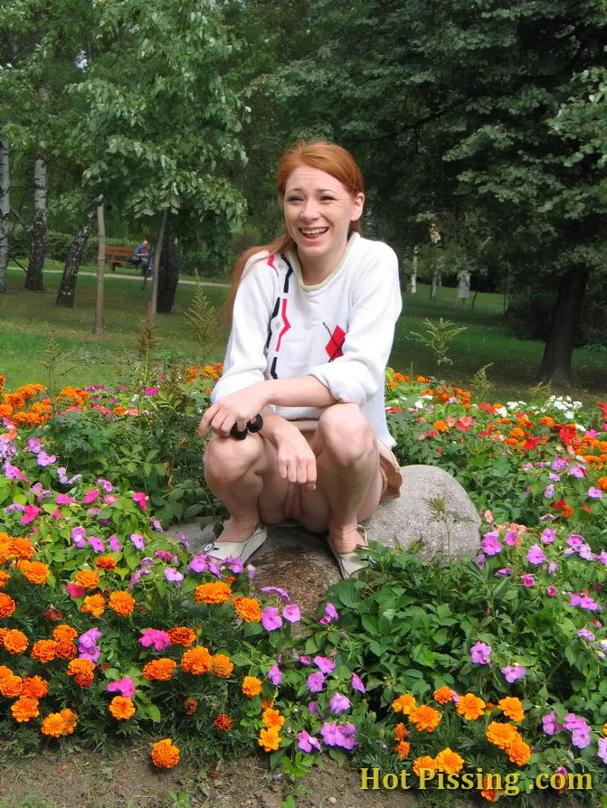 Naughty wench squats in the middle of a flowerbed and makes a pee-pee #76573092