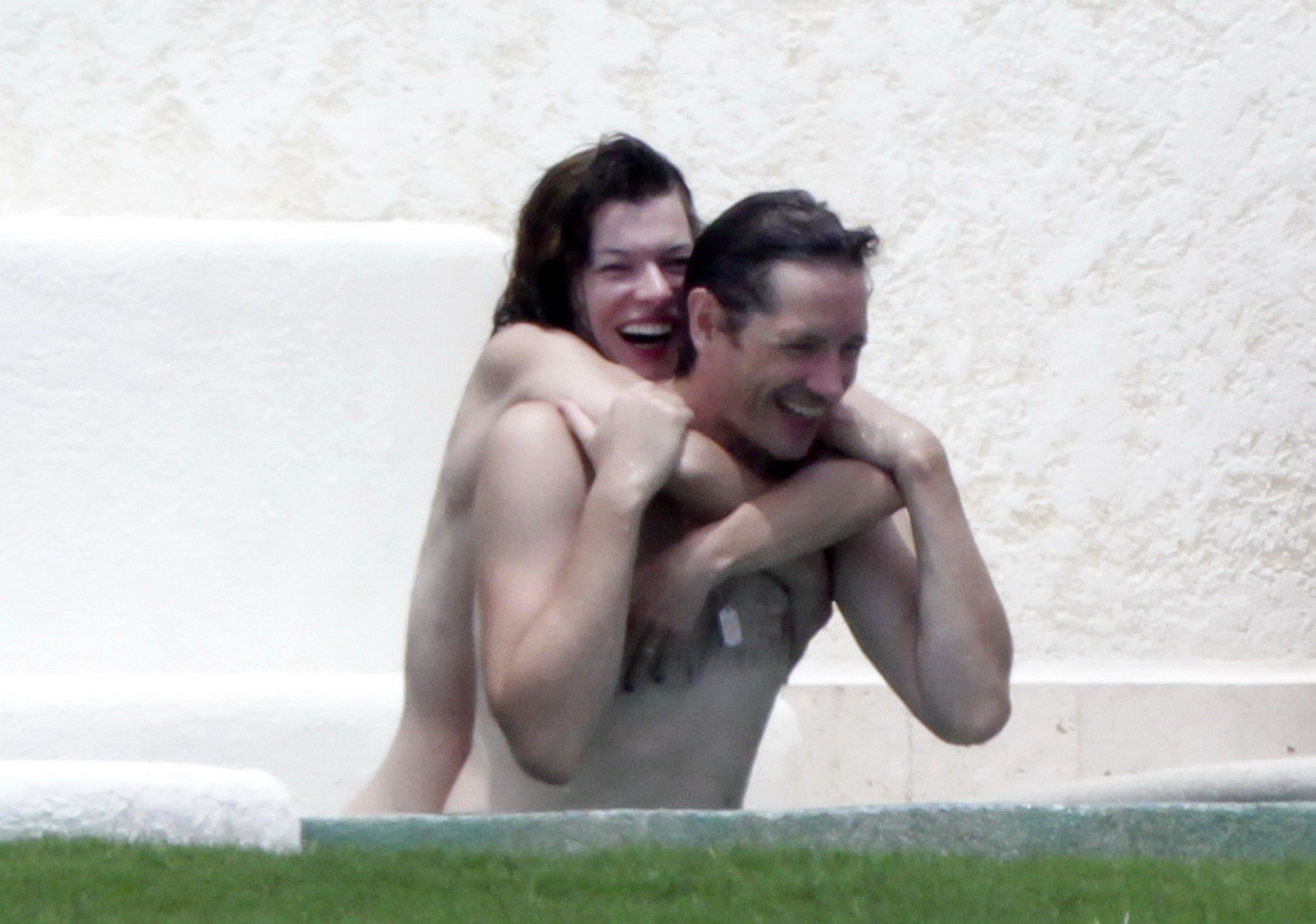 Milla Jovovich topless but hiding her boobs in Cabo San Lucas #75290605