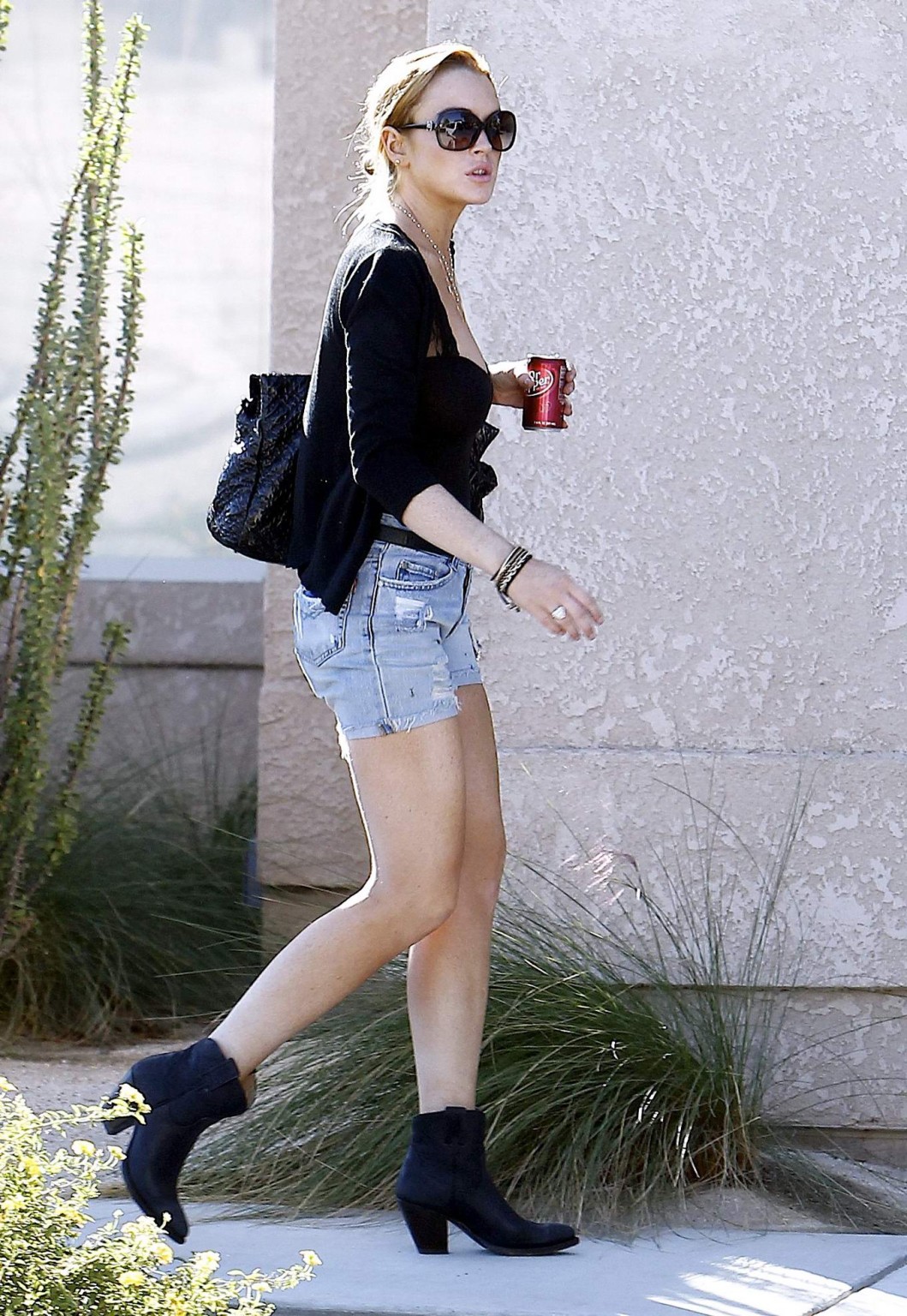 Lindsay Lohan leggy  cleavy wearing low cut top  denim shorts at the Betty Ford  #75326072