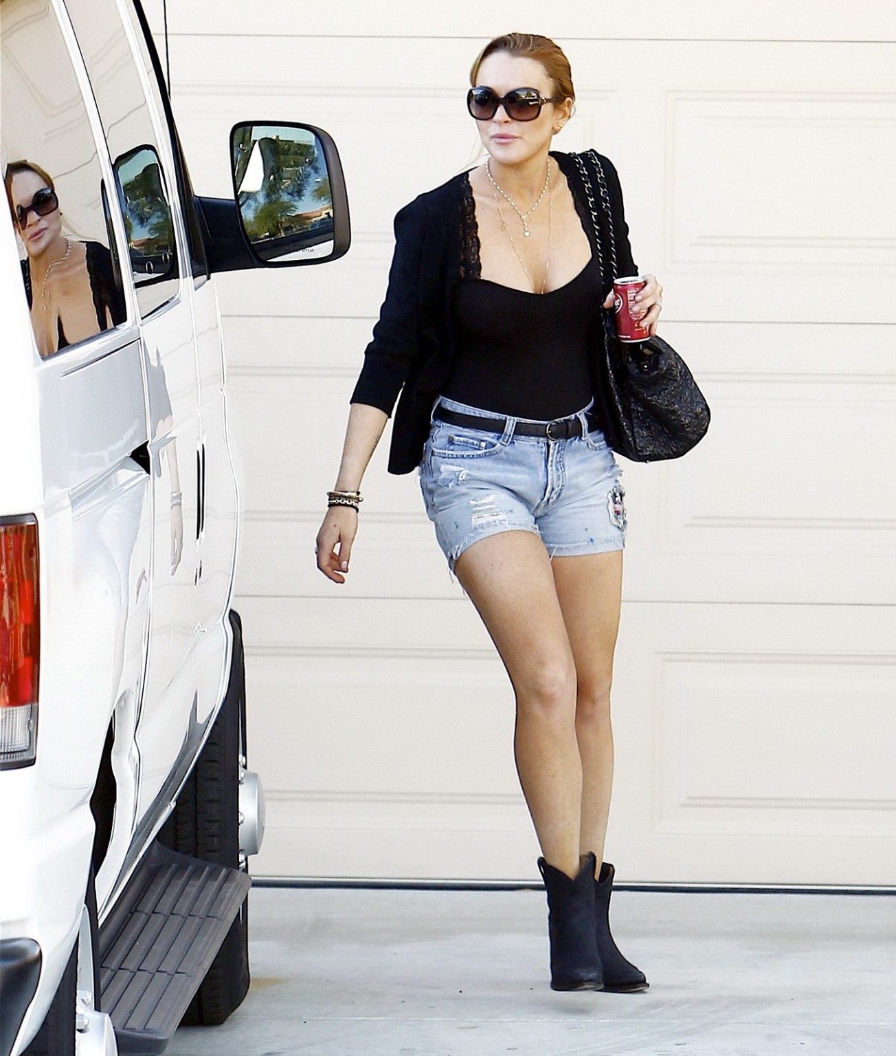 Lindsay Lohan leggy  cleavy wearing low cut top  denim shorts at the Betty Ford  #75326085