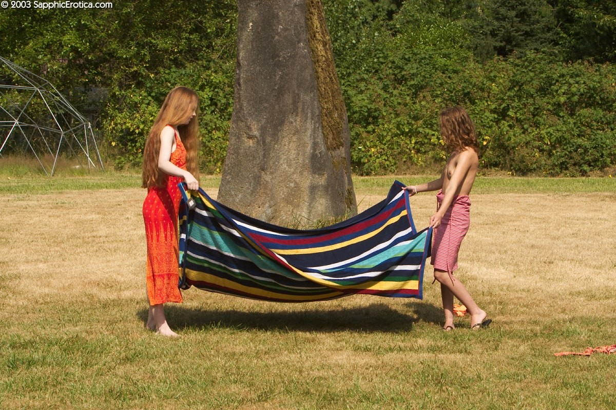 Outdoor teens shower and play on blanket #67422498