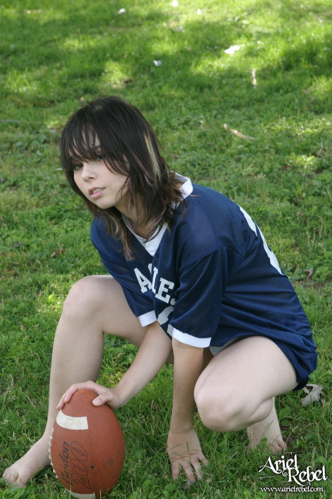 Football loving teen girl outdoors #67115784