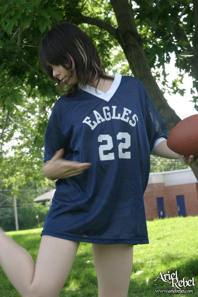 Football loving teen girl outdoors #67115802