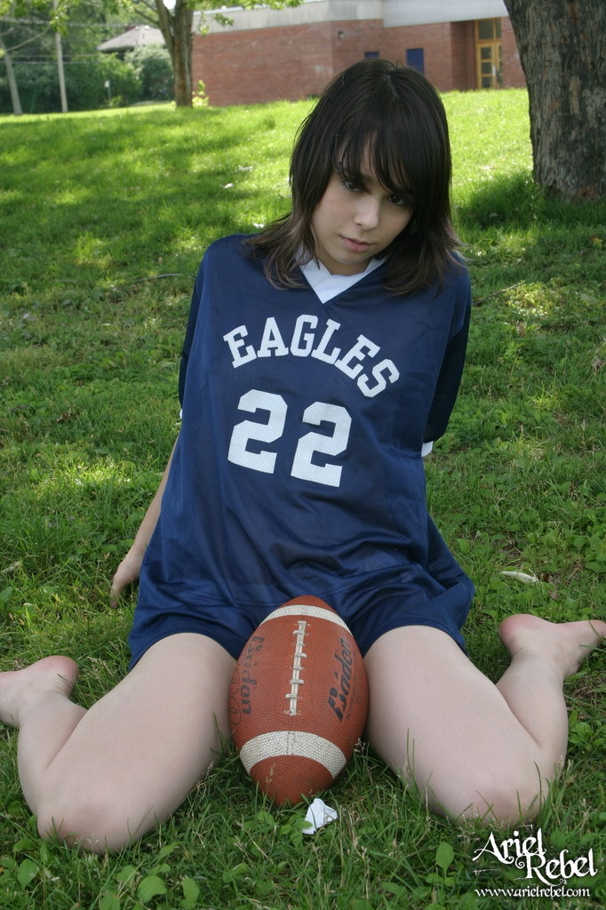 Football loving teen girl outdoors #67115819