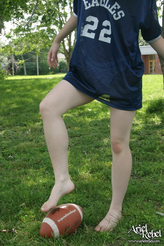 Football loving teen girl outdoors #67115827