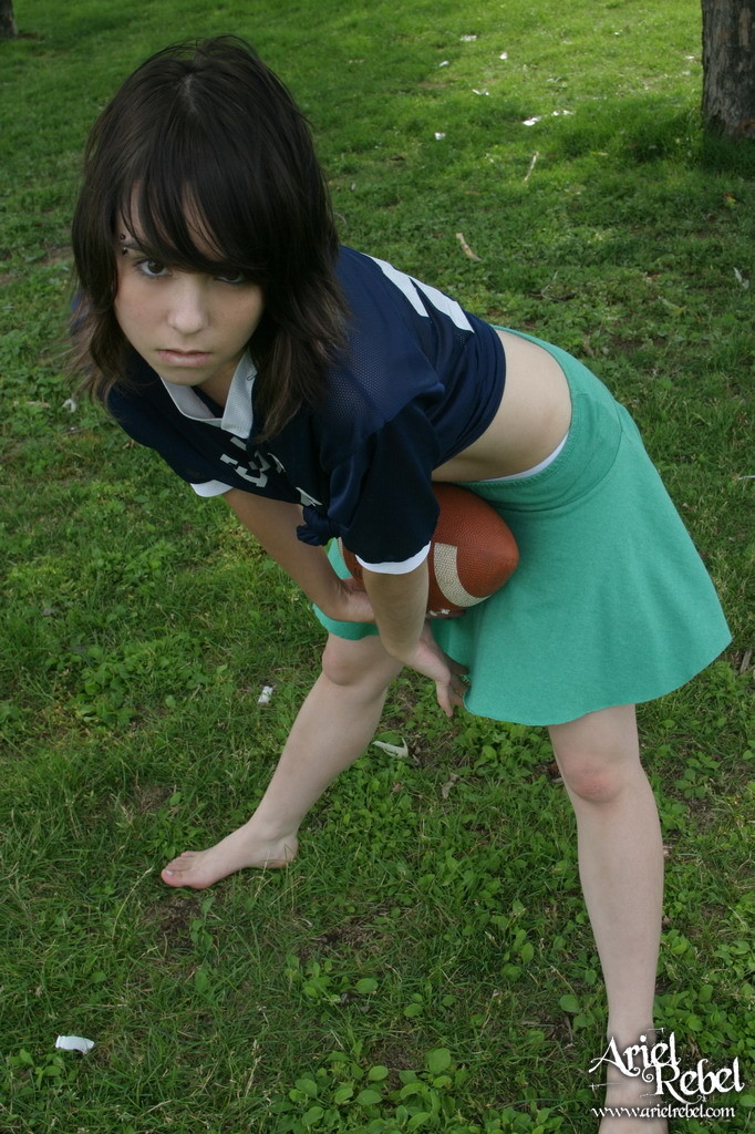 Football loving teen girl outdoors #67115876