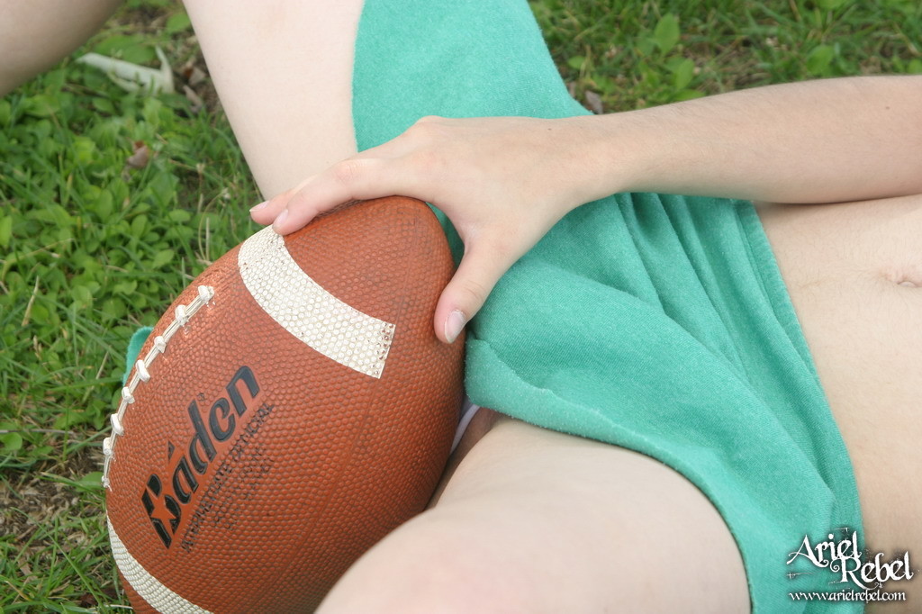 Football loving teen girl outdoors #67115916