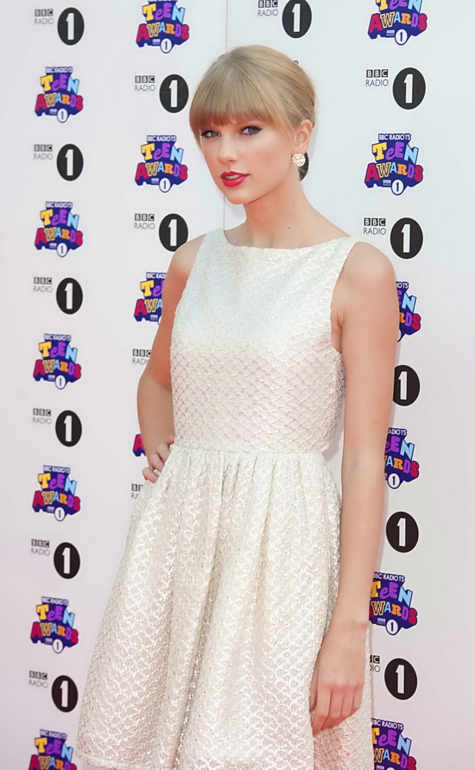 Taylor Swift showing her hot body in white bare back mini dress at BBC Radio 1 T #75251339