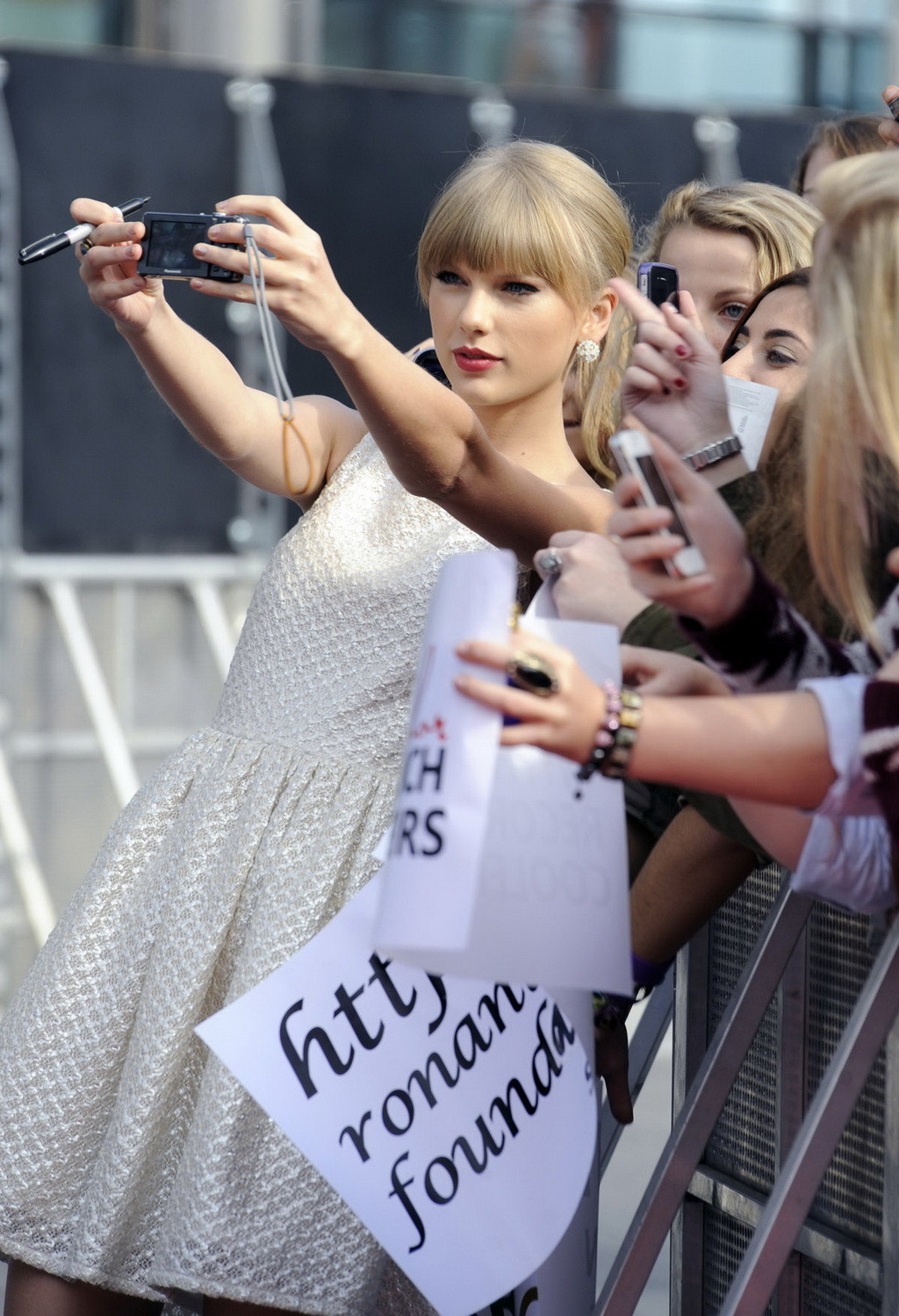 Taylor Swift showing her hot body in white bare back mini dress at BBC Radio 1 T #75251375