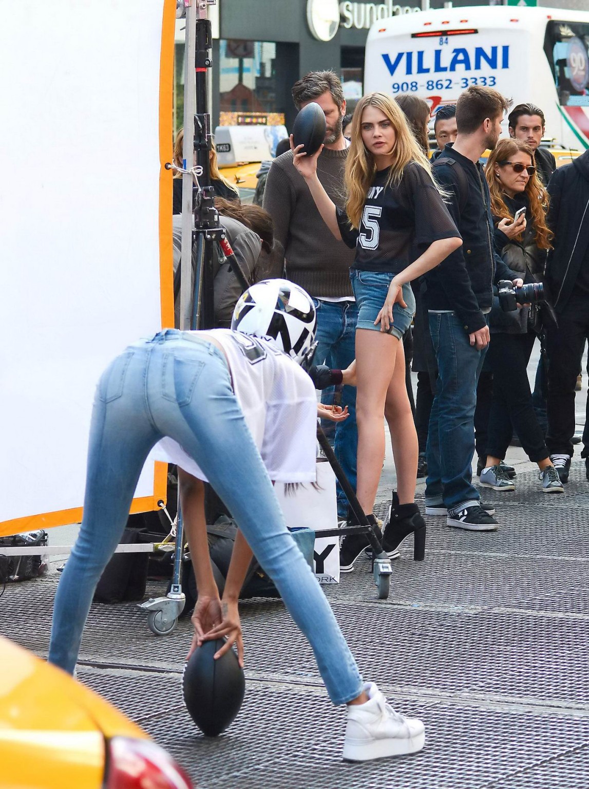 Cara Delevingne shows off her legs  ass wearing denim hotpants on the set of DKN #75215684