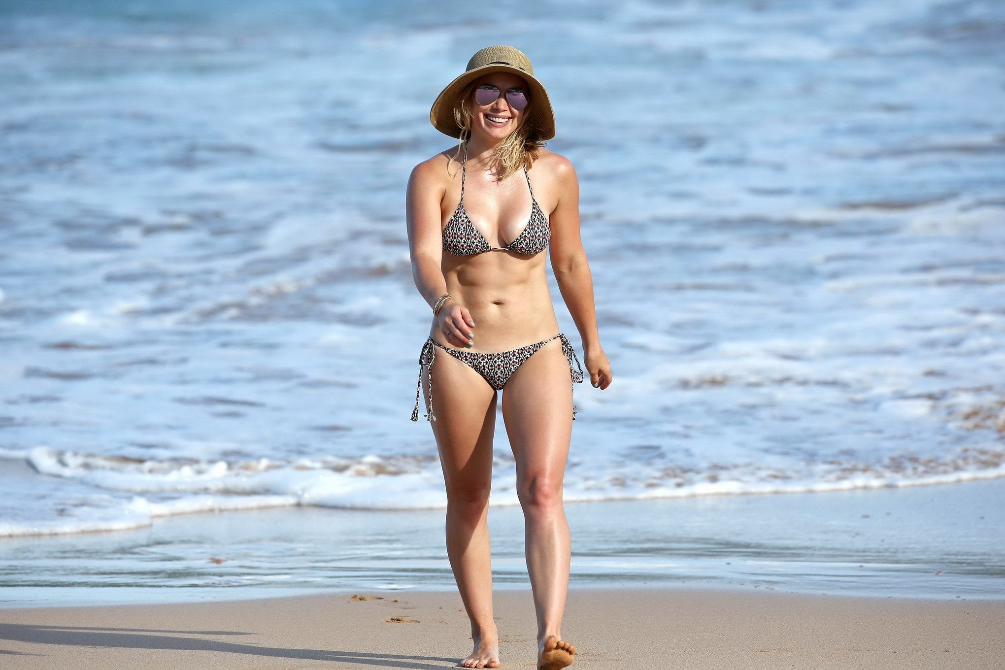 Hilary Duff showing off her curvy bikini body at a beach #75152645