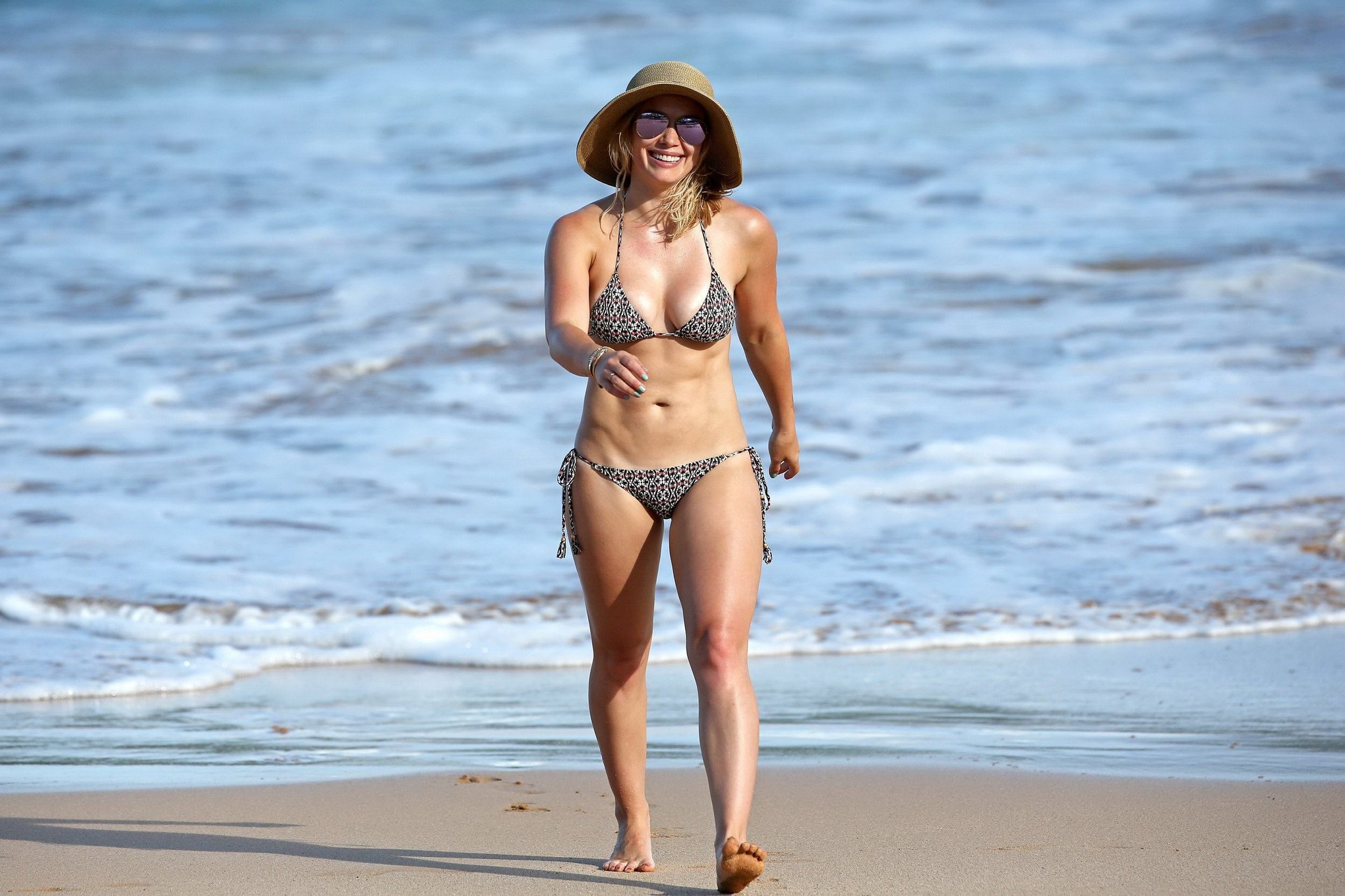 Hilary Duff showing off her curvy bikini body at a beach #75152654