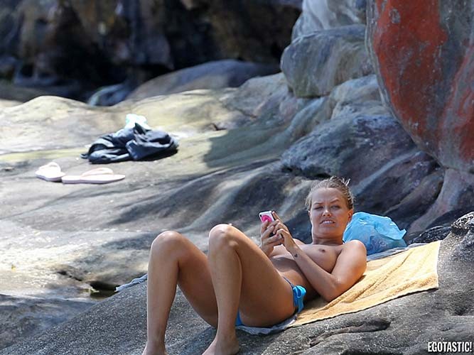 Lara Bingle topless sunbathing on beach paparazzi photos #75278411