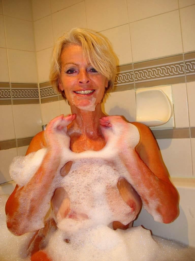 Blonde hairy granny spreads wet mature pussy in the bathtub #77254349