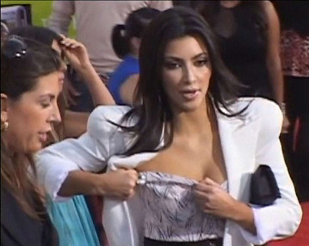 Kim Kardashian adjusting her top in front of camera and exposing her nice big ti #75360361