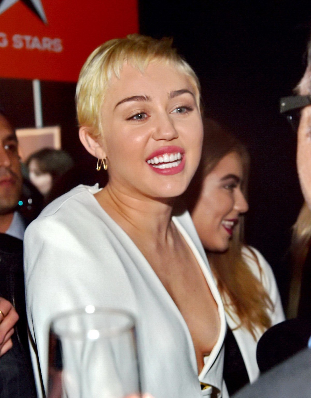 Miley Cyrus Braless Shows Cleavage Attending The W Magazine Shooting Stars Exhib
