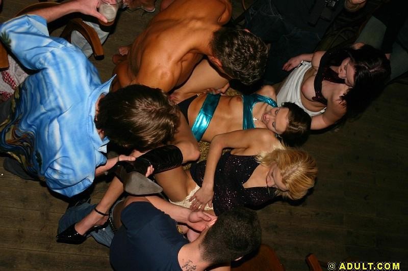 group of people having an orgy in a public bar #78922158