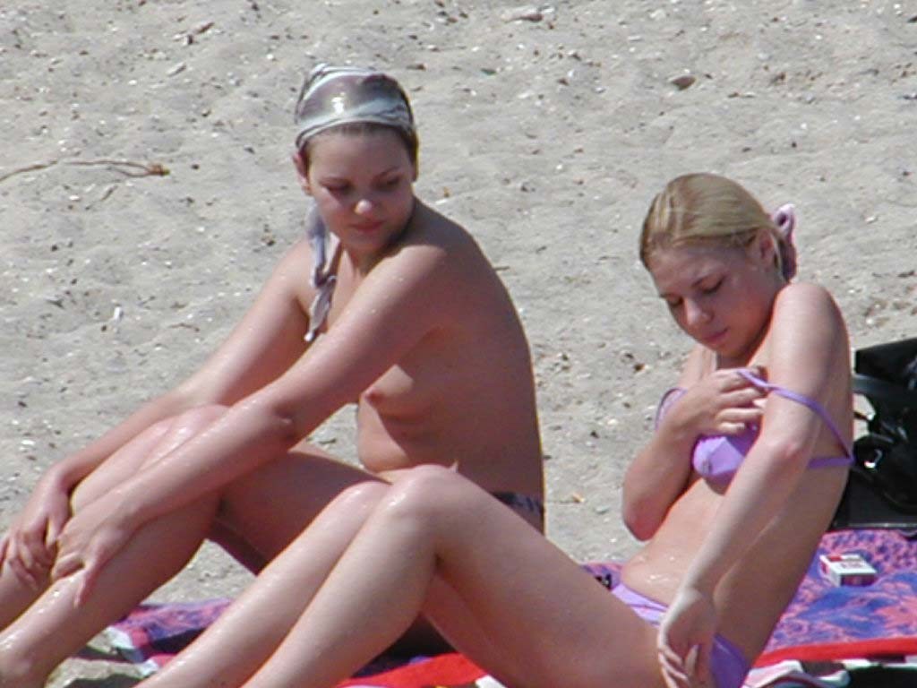 Watch this busty nudist rubbing sand on her body #72252062