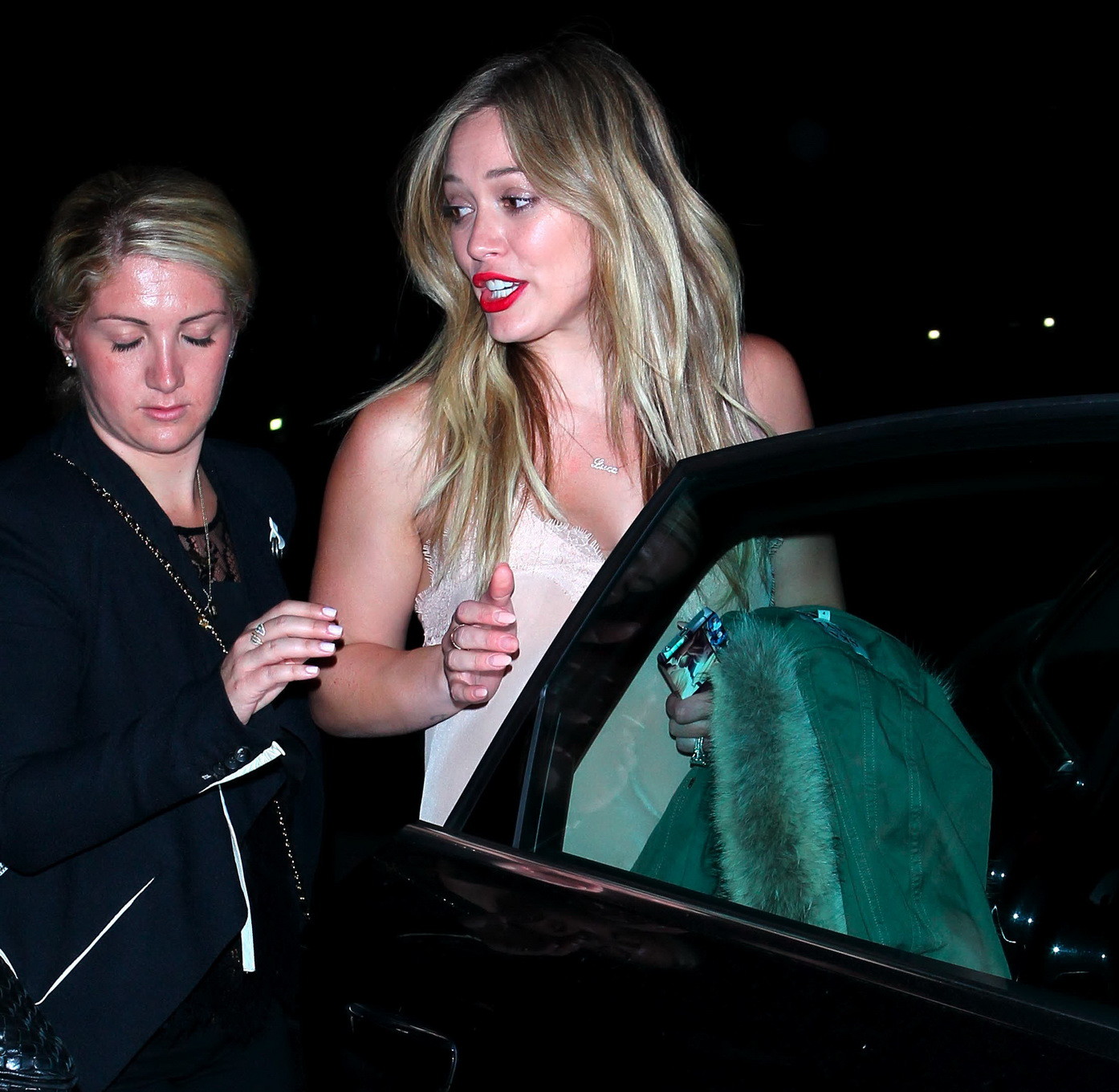 Hilary Duff wearing tank top and red tights leaving Pink concert at the Staples  #75215905