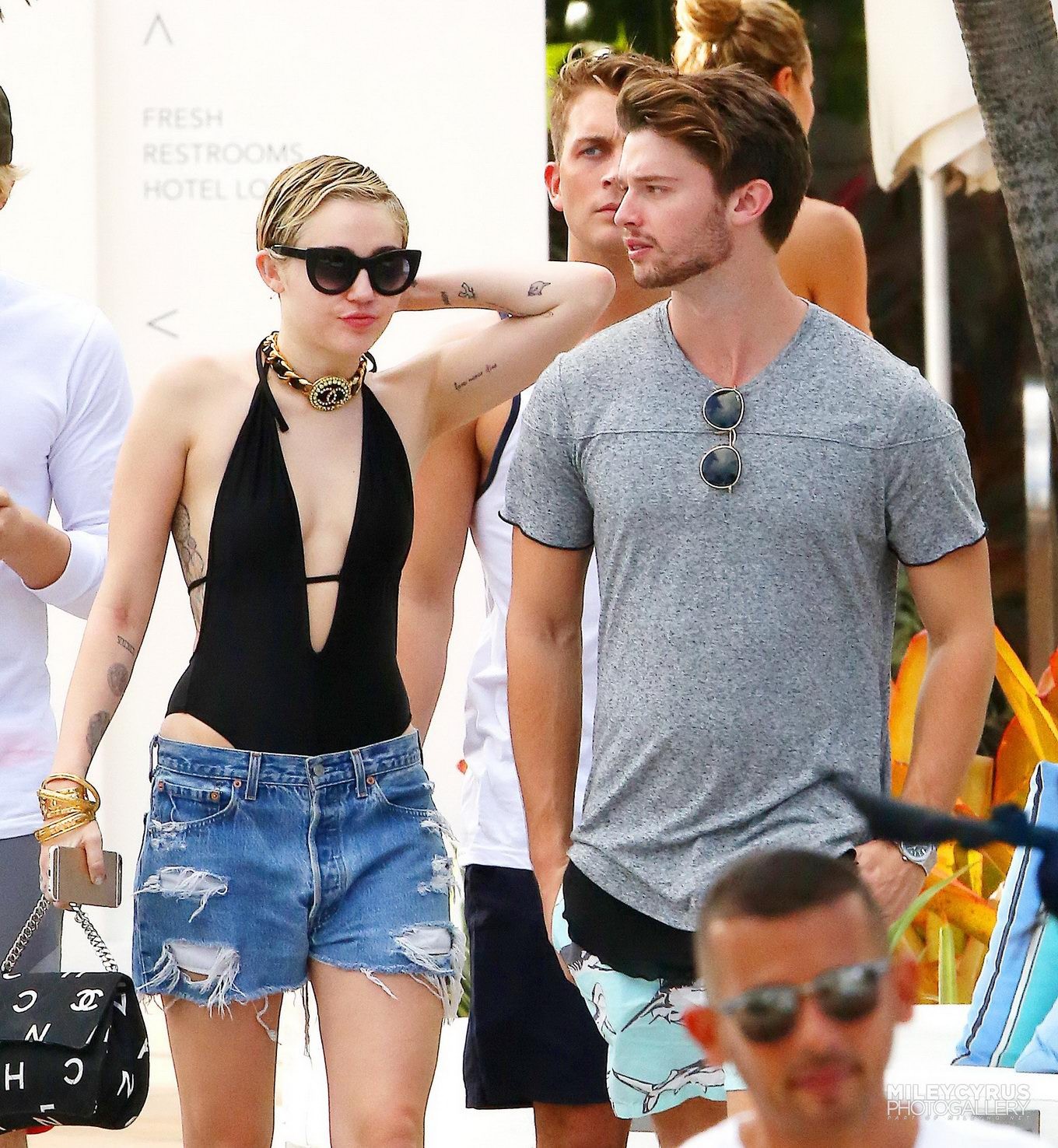 Miley Cyrus wearing swimsuit and hotpants at a pool in Miami #75178811