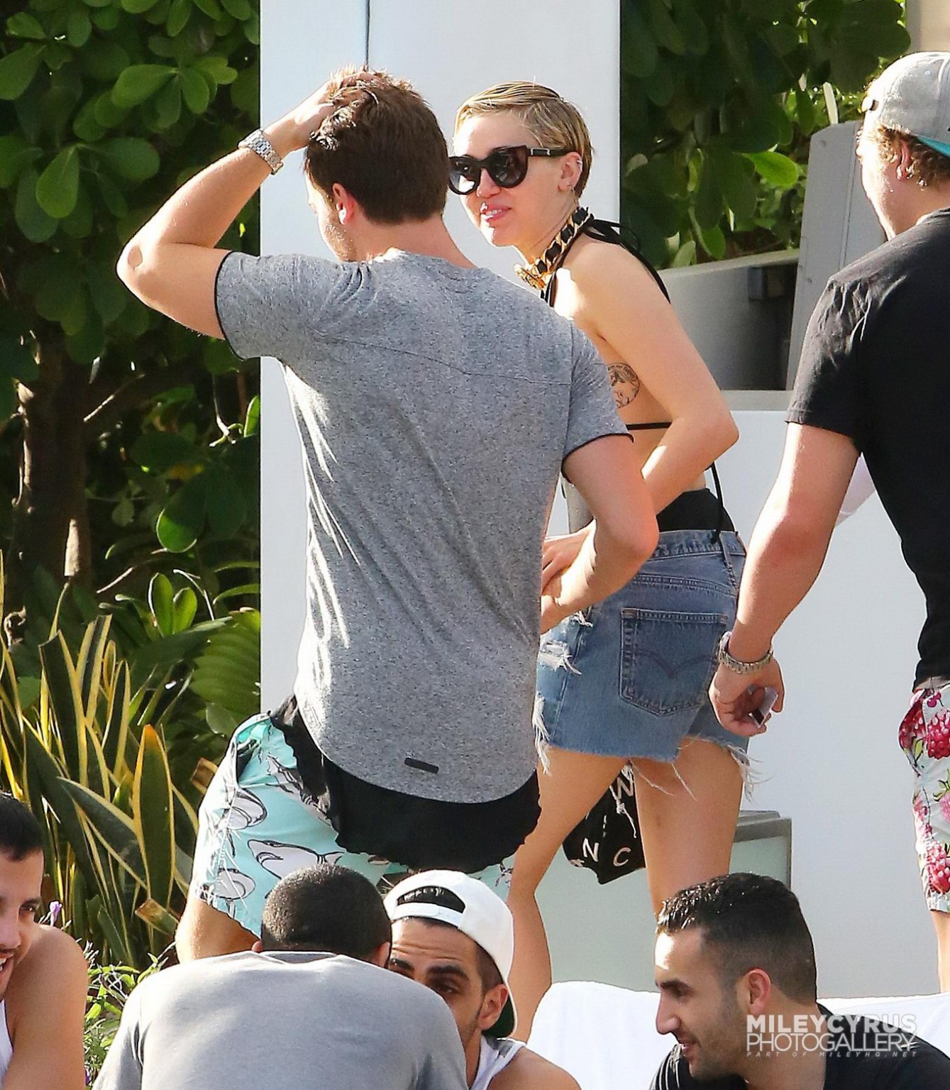 Miley Cyrus wearing swimsuit and hotpants at a pool in Miami #75178814