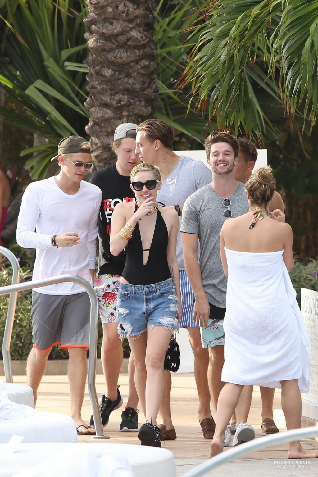 Miley Cyrus wearing swimsuit and hotpants at a pool in Miami #75178830