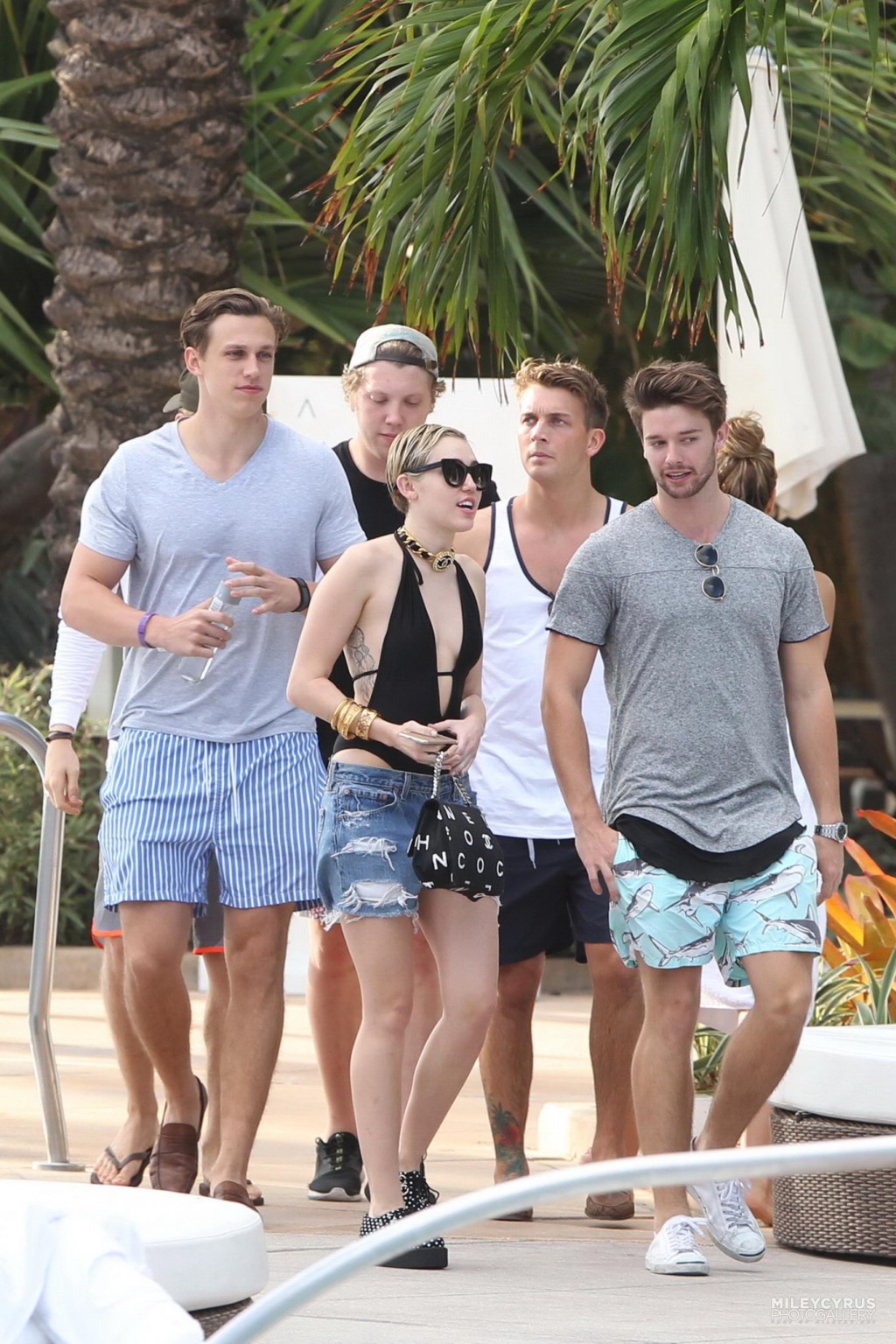 Miley Cyrus wearing swimsuit and hotpants at a pool in Miami #75178833