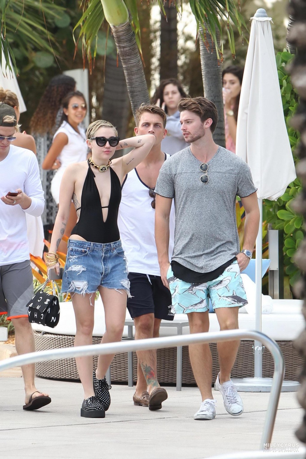 Miley Cyrus wearing swimsuit and hotpants at a pool in Miami #75178843