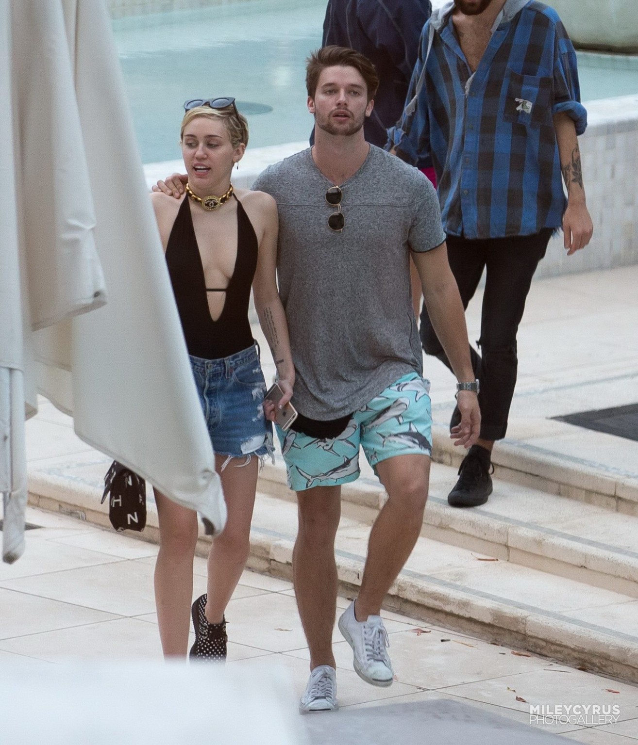 Miley Cyrus wearing swimsuit and hotpants at a pool in Miami #75178845