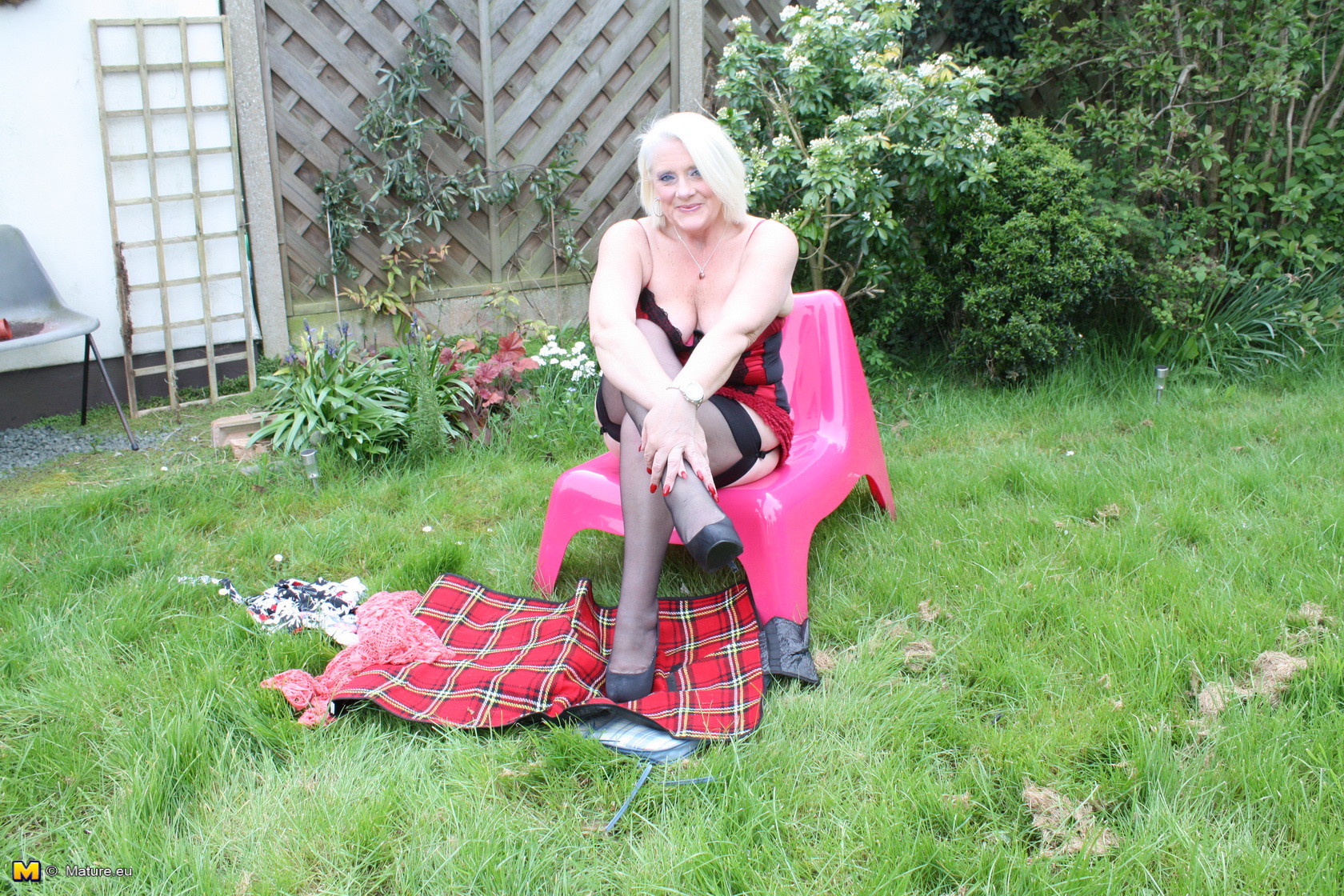 Naughty British housewife getting dirty in the garden #67430422